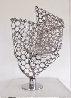 "The sculpture is intended as a futuristic symbol of a map, developed from a 3-D visualization of object in their space. Perforated stainless steel mesh, randomly kneaded manually, I've welded it to a solid steel base." Artist: Luiz Campoy Medium: Stainless steel Dimensions: 30 x 40 x 50cm Genre: Sculpture Year: 2019