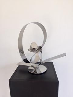 His ingenious conceptual art creations are contemporary forms that are aesthetically pleasing to the viewer, left for interpretation. These stainless steel plate tapes are guillotine cut, twisted and welded to create movement, an action and reaction. Artist: Luiz Campoy Material: Stainless steel Dimensions: 40 x 20 x 36cm Genre: Sculpture Shipping worldwide