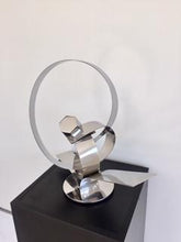 Load image into Gallery viewer, His ingenious conceptual art creations are contemporary forms that are aesthetically pleasing to the viewer, left for interpretation. These stainless steel plate tapes are guillotine cut, twisted and welded to create movement, an action and reaction. Ar