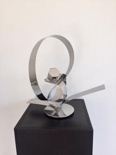 His ingenious conceptual art creations are contemporary forms that are aesthetically pleasing to the viewer, left for interpretation.  These stainless steel plate tapes are guillotine cut, twisted and welded to create movement, an action and reaction.  Artist: Luiz Campoy  Material: Stainless steel  Dimensions: 40 x 20 x 36cm  Genre: Sculpture  Shipping worldwide