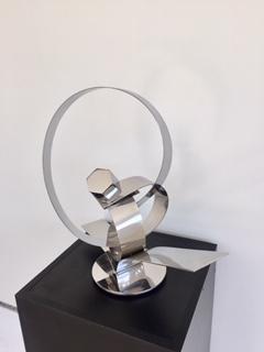 His ingenious conceptual art creations are contemporary forms that are aesthetically pleasing to the viewer, left for interpretation. These stainless steel plate tapes are guillotine cut, twisted and welded to create movement, an action and reaction. Ar